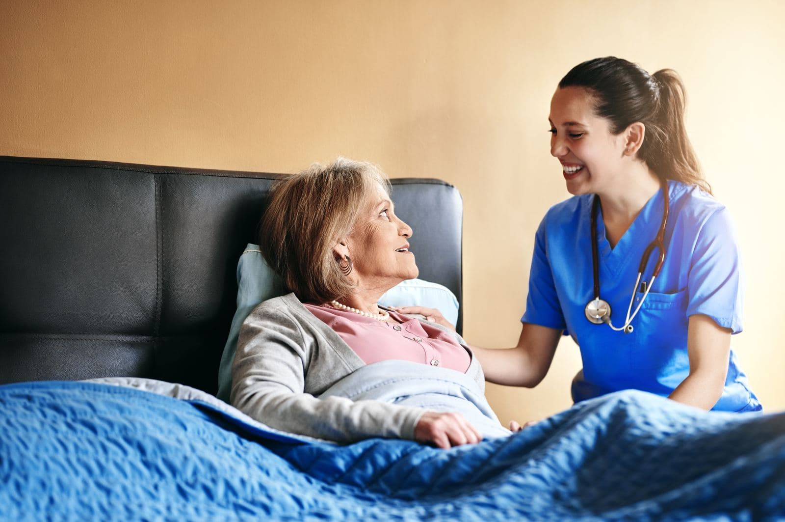 CHPN Certification Exam Preparation Friendly hospice nurse visiting an elderly woman at home, providing Hospice and Palliative Care during CHPN certification exam preparation