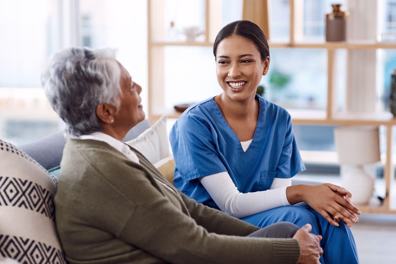 CHPPN Certification – Certified Hospice and Palliative Pediatric Nurse Caring nurse interacting with a senior woman at home, reflecting the compassionate hospice and palliative care central to the CHPPN certification
