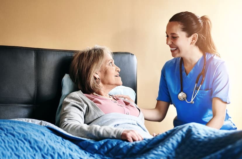 Your Path to CHPPN Certification Friendly health worker comforting a senior woman patient, illustrating hospice and palliative care for CHPPN certification exam preparation