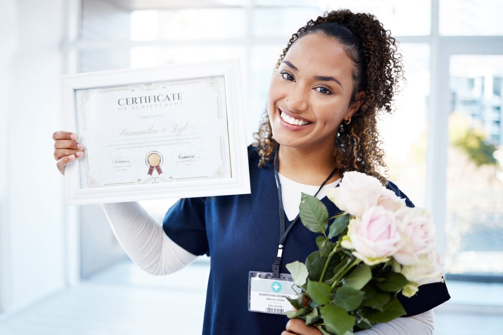 Benefits of CHPN Certification Nurse proudly holding the Hospice and Palliative Care CHPN certification credential after passing the exam
